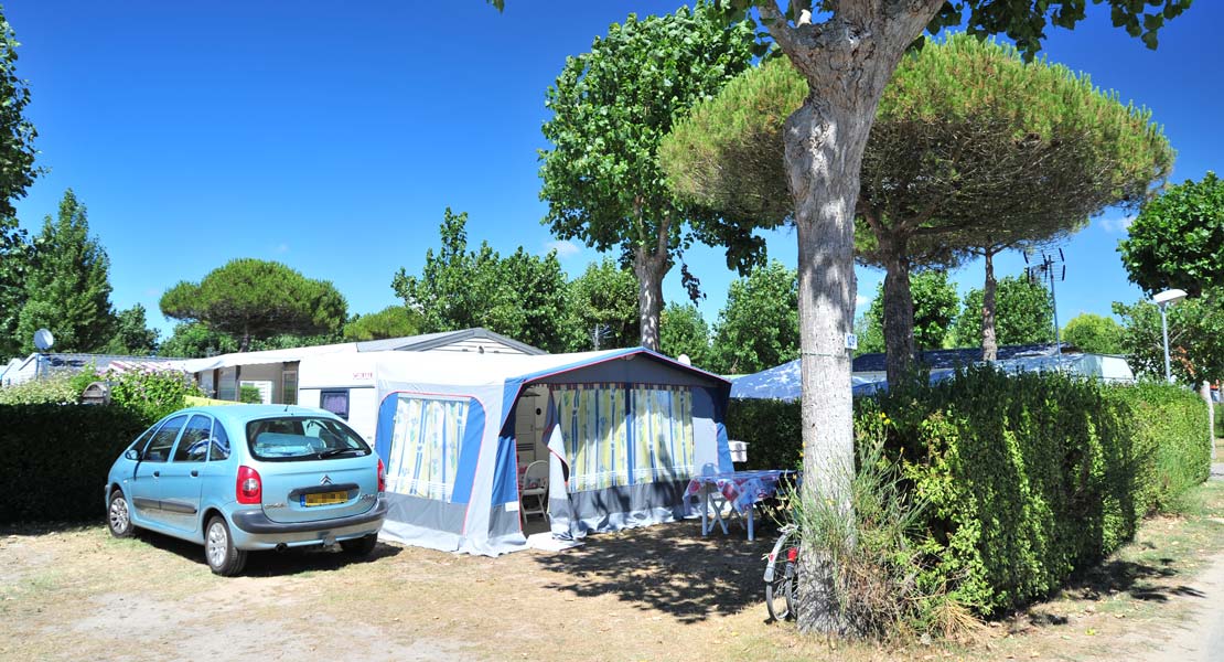 Pitch for tent with car at La Plage campsite in Vendée