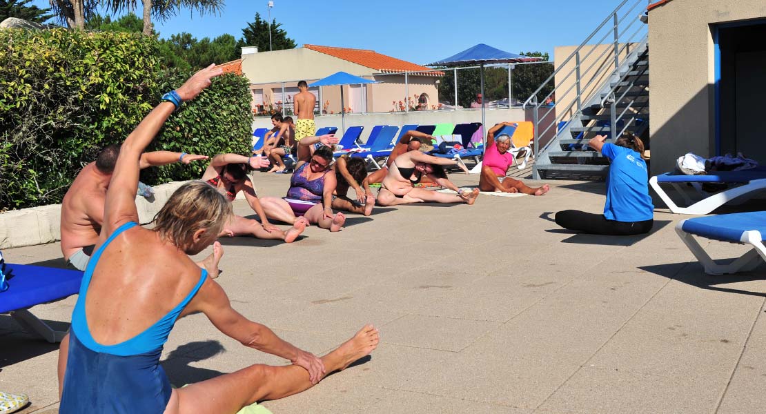 Gymnastics muscle awakening activity at La Plage campsite