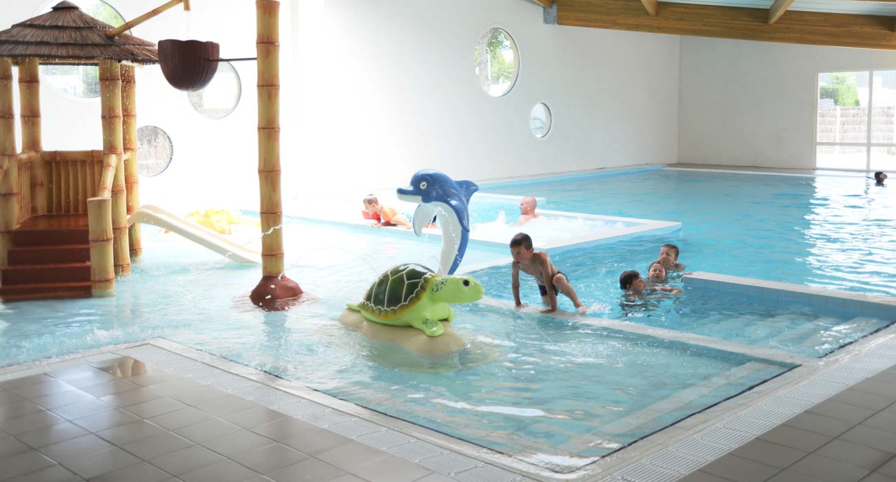 View of the paddling pool and children's area of the campsite's water park in Vendée