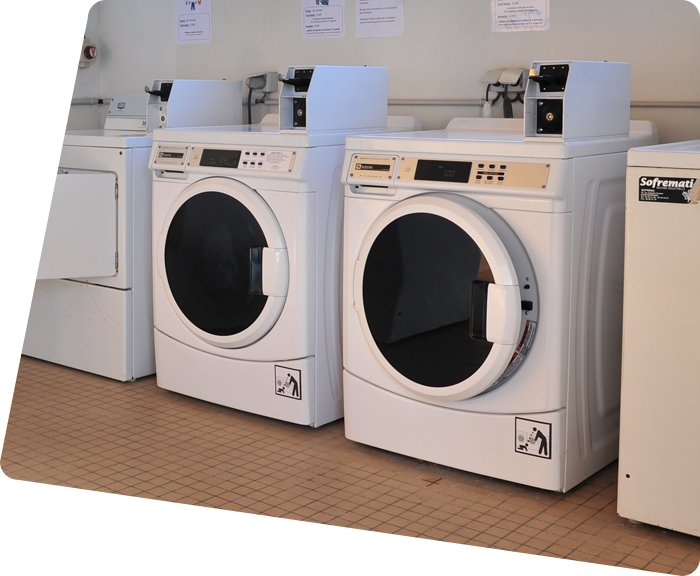 Washing machines and dryers in the laundry room of the campsite in Saint-Hilaire