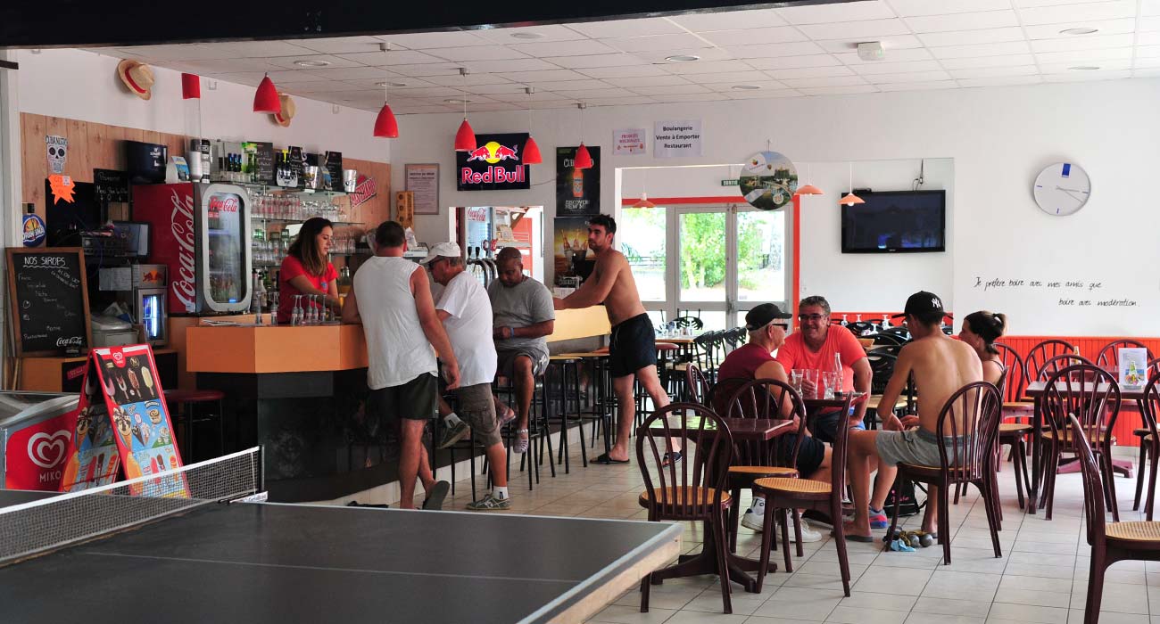 Interior of the bar with ping-pong table at Le Clos des Pins campsite in Saint-Hilaire 85