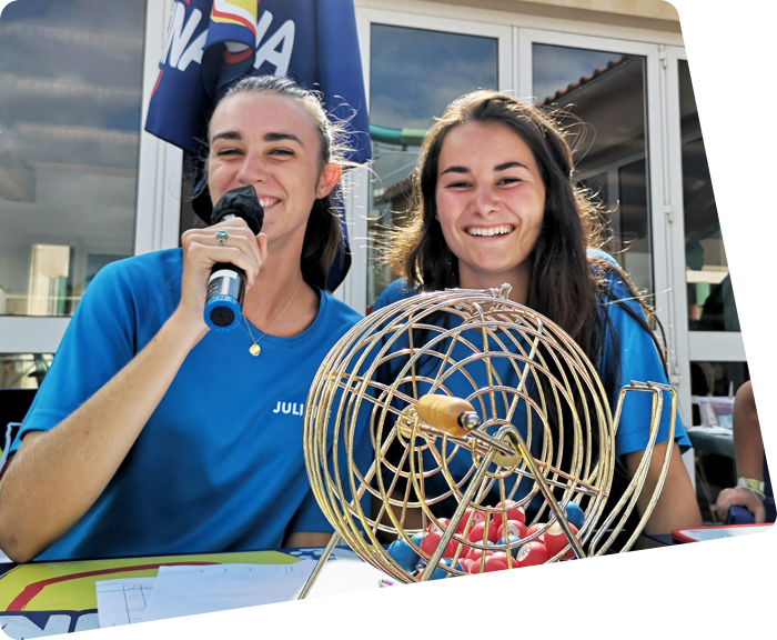 Two activity leaders organizing a tournament at La Plage campsite in Vendée