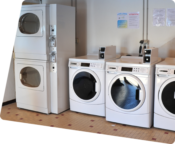 Dryer and washing machines in the laundry room of La Plage campsite in Vendée