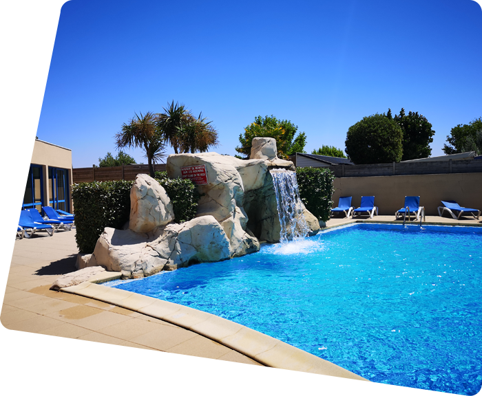 Waterfall in the outdoor aquatic area of La Plage campsite in Saint-Hilaire