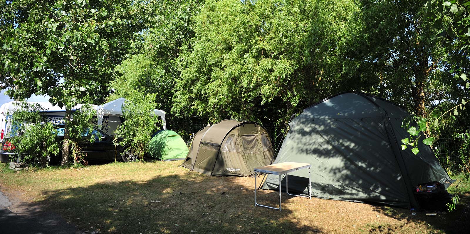 Tents on a shaded tent camping pitch in Saint-Hilaire 85