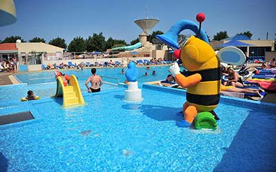 The paddling pool and play area for children at the campsite's aquatic area