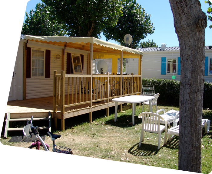 Terrace of a mobile home and garden furniture at La Prairie campsite in Saint-Hilaire