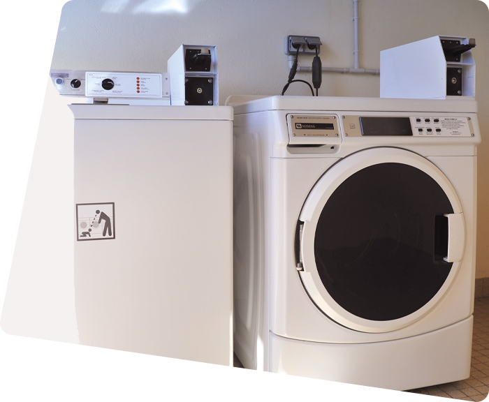 Washing machines and dryers in the laundry room of the campsite in Saint-Hilaire