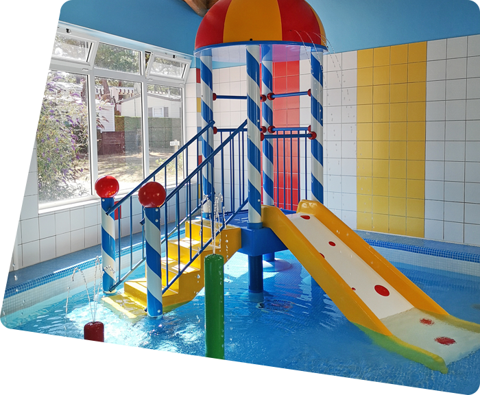 Slides in the paddling pool of the covered aquatic area at the campsite in Saint-Hilaire