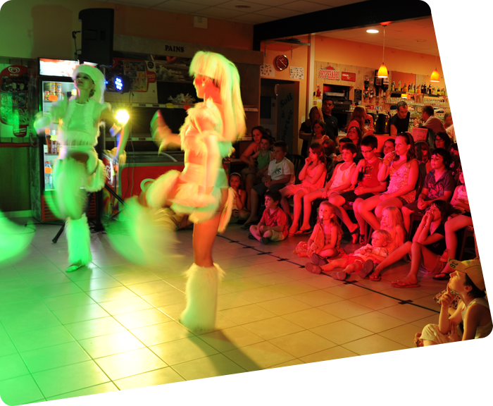 Cheerleaders during a lively evening at Le Clos des Pins campsite in Saint-Hilaire