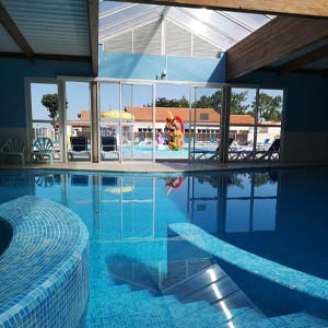 Pool of the indoor covered swimming pool at the campsite in Saint-Hilaire