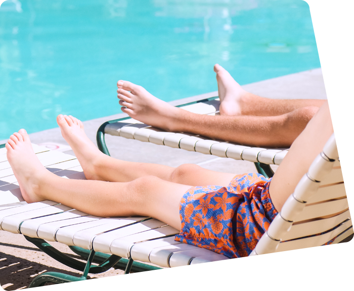 Legs on a deckchair by the swimming pool of the campsite in Saint-Hilaire in Vendée