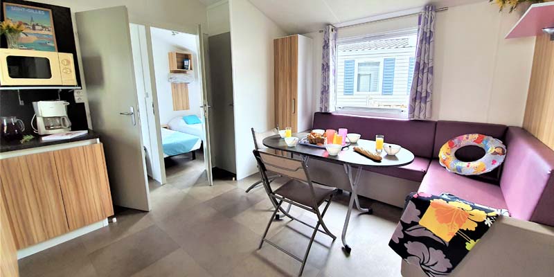 Comfortable table and sofas in a mobile home in Vendée